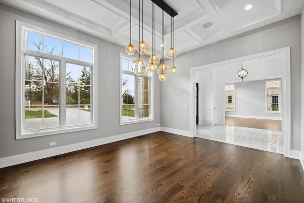 a kitchen with furniture and large windows