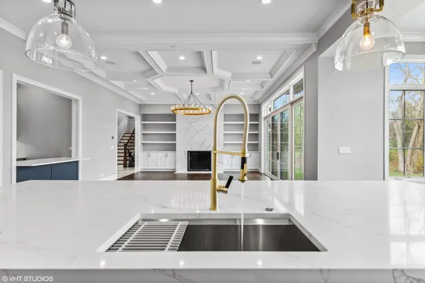 a kitchen with stainless steel appliances granite countertop a stove and a refrigerator