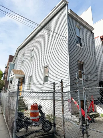 a view of a patio with table and chairs potted plants and a wooden deck