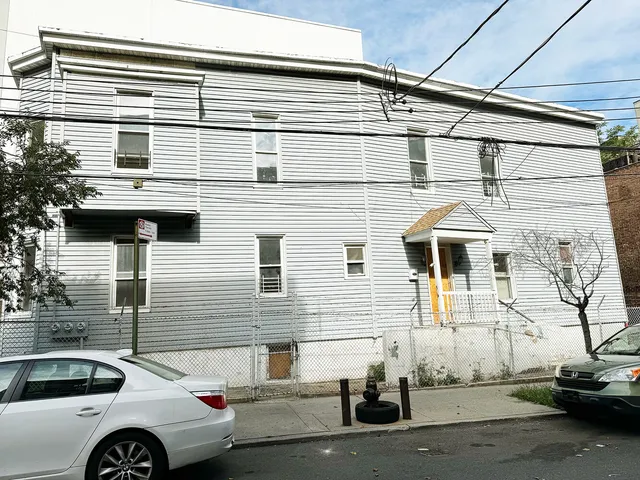 a front view of a house with parking