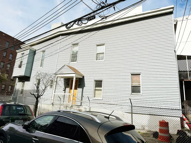 a front view of a house with a balcony
