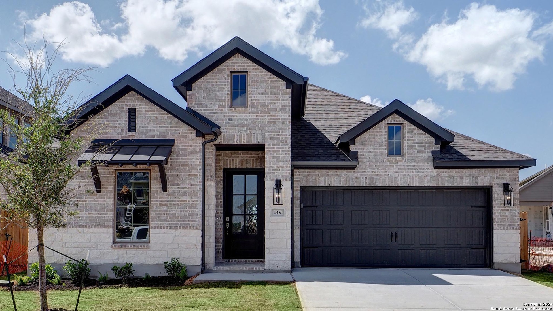 a front view of a house with a yard