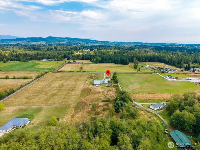 a view of a swimming pool with a lake view and mountain view