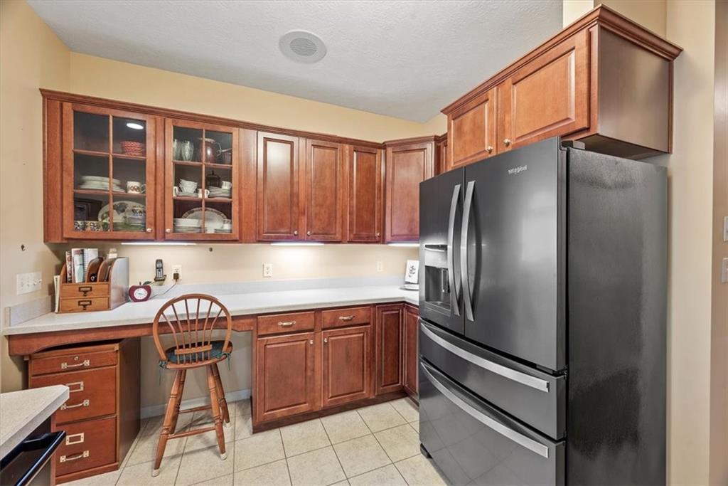 509 Madison Boulevard Freedom, PA 15042 - Photo 11 of 41 a kitchen with stainless steel appliances granite countertop a refrigerator and a sink