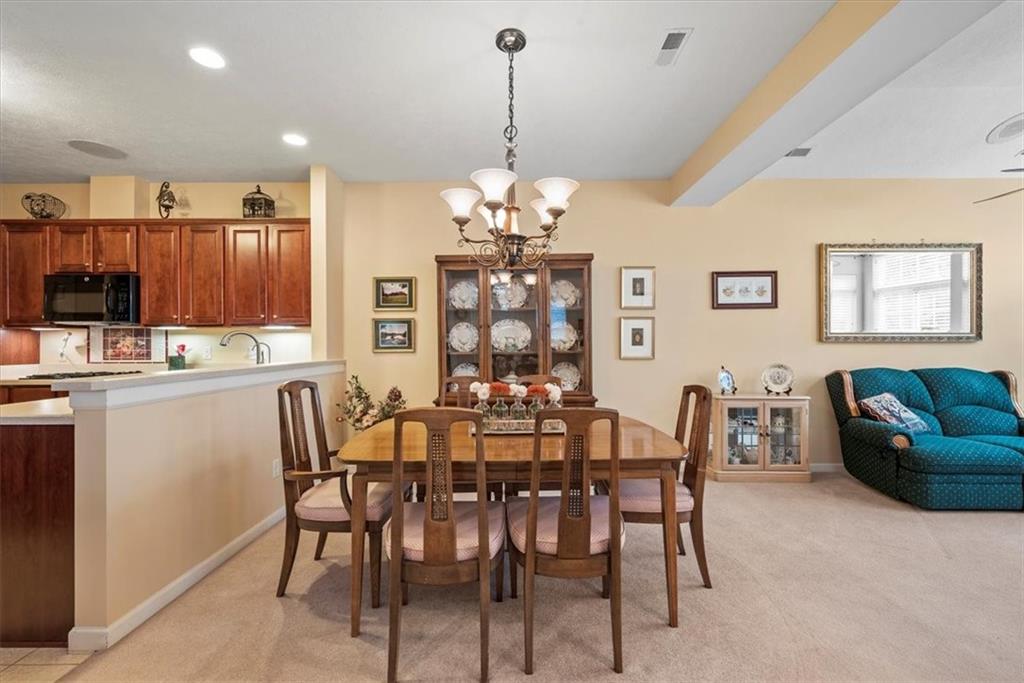509 Madison Boulevard Freedom, PA 15042 - Photo 12 of 41 a view of a dining room with furniture and chandelier