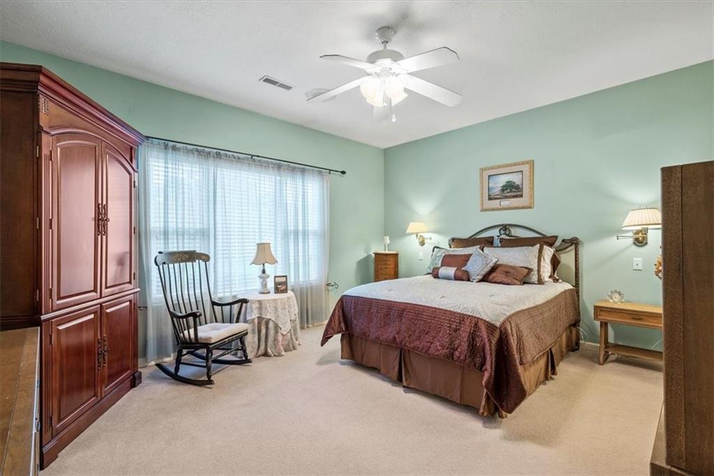 509 Madison Boulevard Freedom, PA 15042 - Photo 15 of 41 a bedroom with a bed chairs and two windows