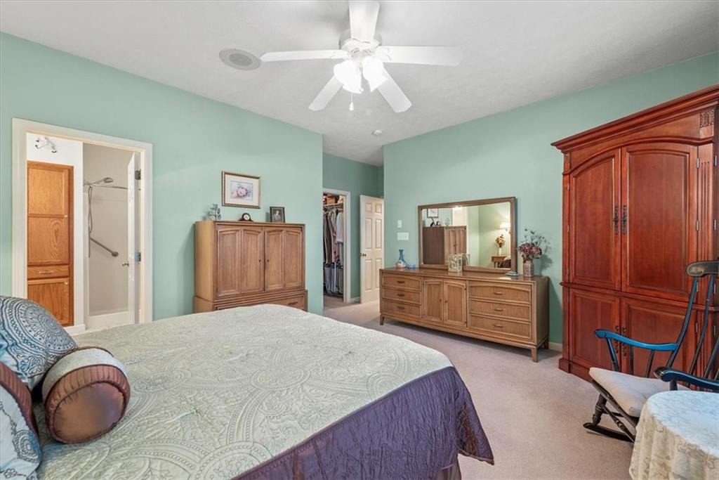 509 Madison Boulevard Freedom, PA 15042 - Photo 16 of 41 a bedroom with a large bed and a chandelier