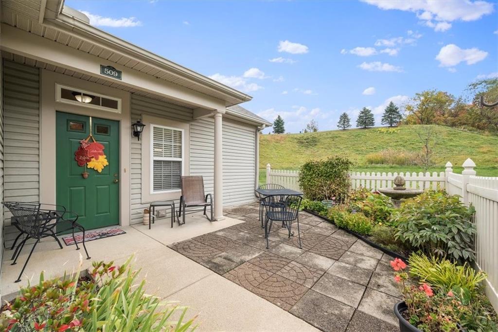509 Madison Boulevard Freedom, PA 15042 - Photo 2 of 41 a swimming pool with outdoor seating and garden