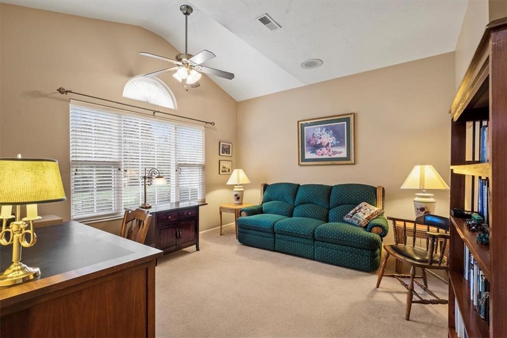 509 Madison Boulevard Freedom, PA 15042 - Photo 21 of 41 a living room with furniture a desk and a flat screen tv