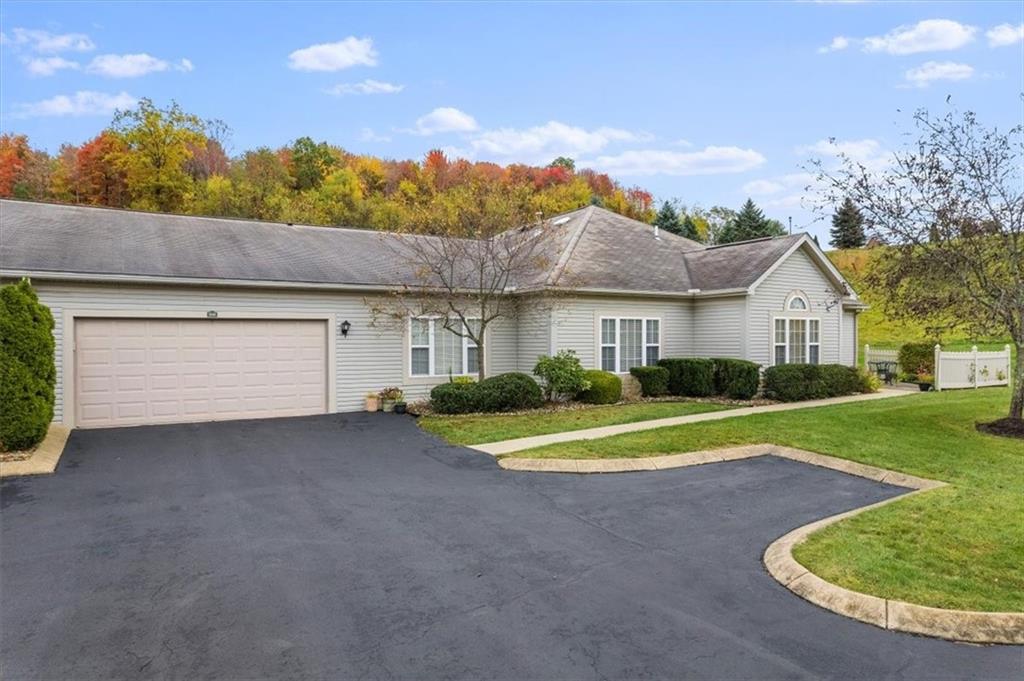 509 Madison Boulevard Freedom, PA 15042 - Photo 31 of 41 a view of a house with a yard and garage