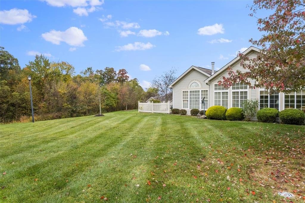 509 Madison Boulevard Freedom, PA 15042 - Photo 33 of 41 a view of a big house with a big yard and large trees