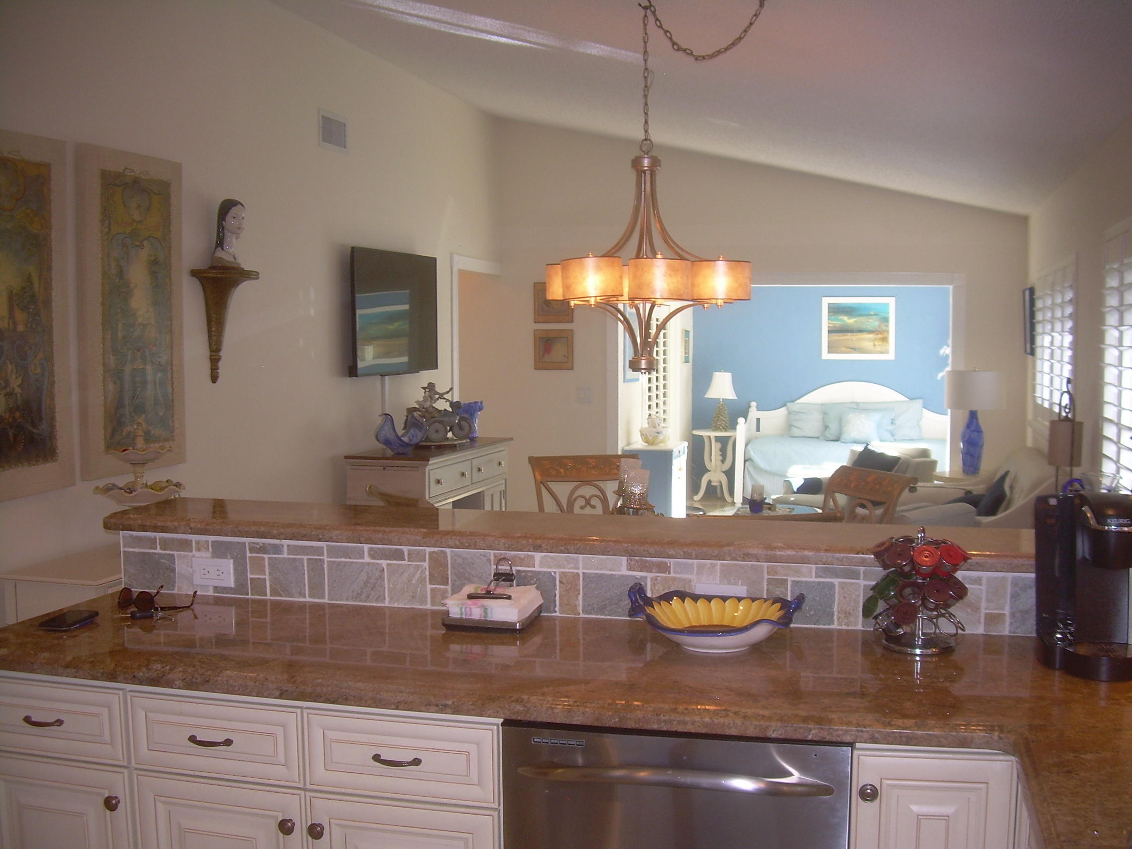 8700 Jasmine Way, Unit B Boca Raton, FL 33496 - Photo 9 of 32 a kitchen with sink and chandelier