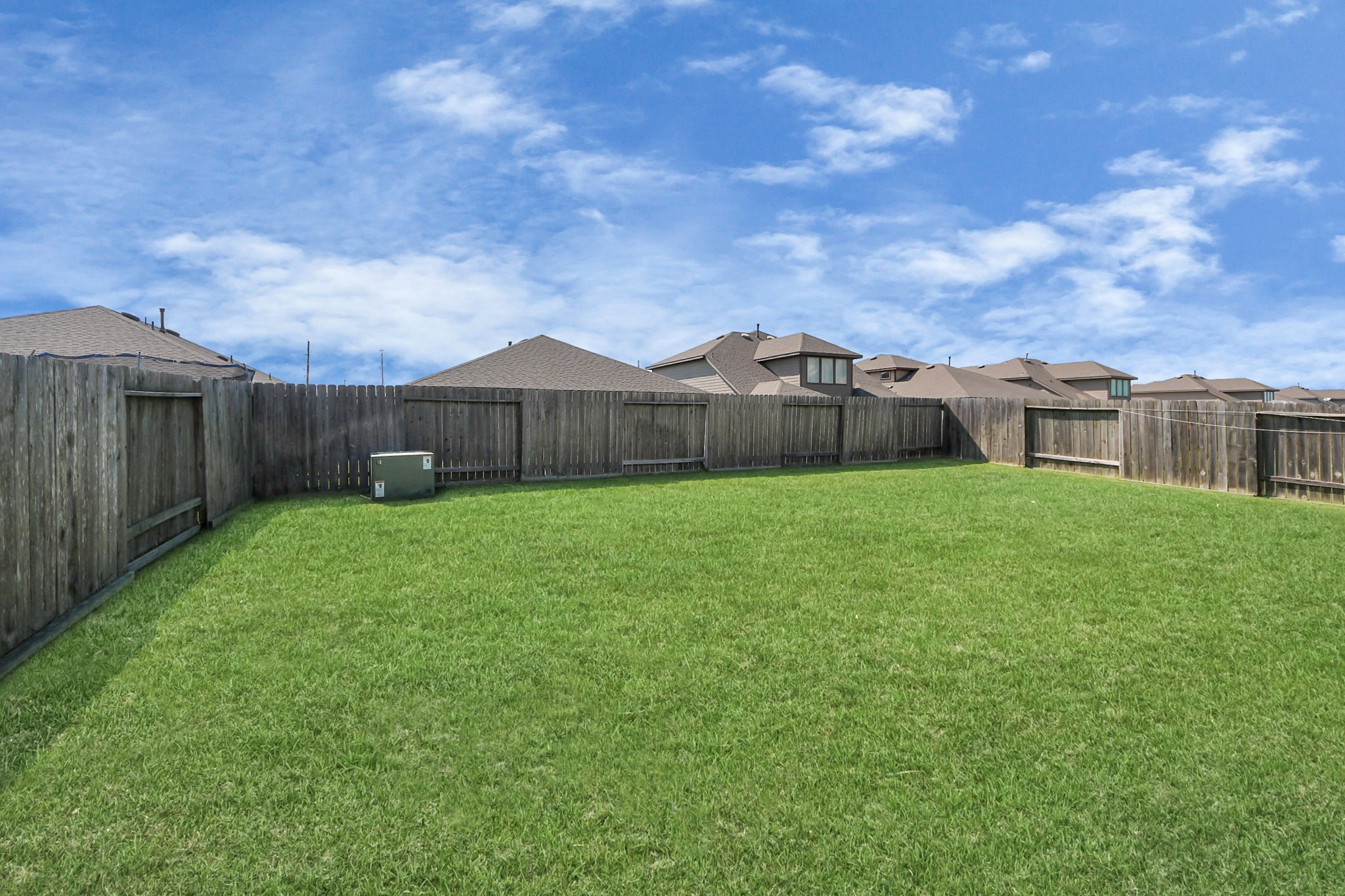 3514 Windham Way Katy, TX 77494 - Photo 40 of 42 a view of a yard with a large tree and a wooden fence