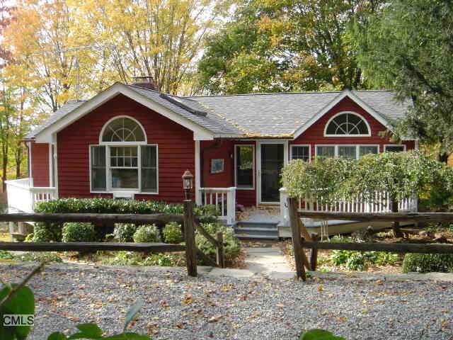 8 Blueberry Hill Road Redding, CT 06896 - Photo 1 of 1 a front view of a house with a garden