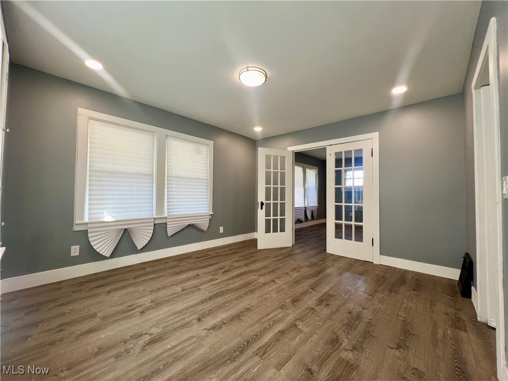 1024 Copley Road Akron, OH 44320 - Photo 14 of 31 Unfurnished room featuring french doors and dark wood-type flooring