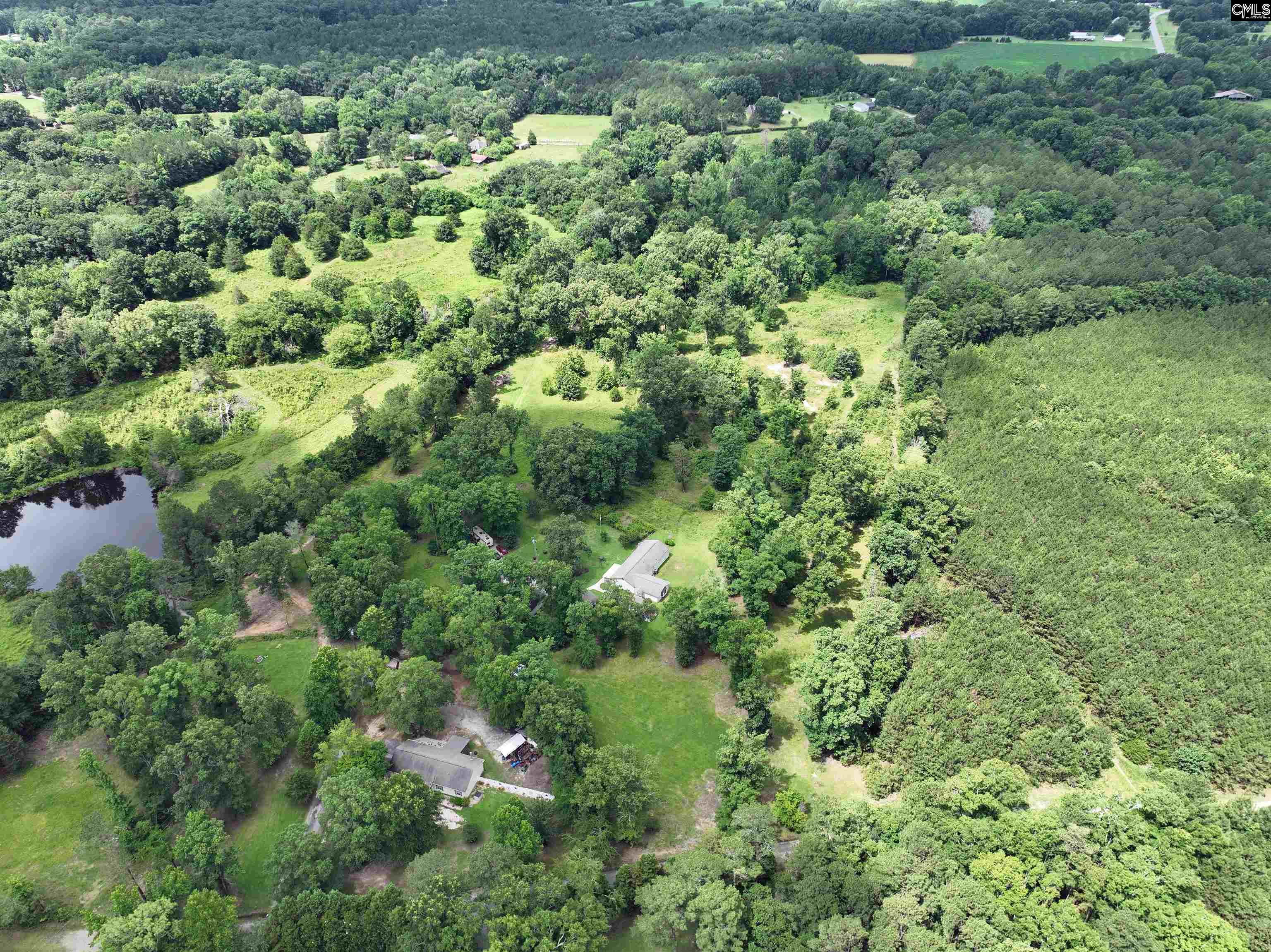 0 Rocky Branch Road Little Mountain, SC 29075 - Photo 22 of 24 an aerial view of residential house with outdoor space and trees all around