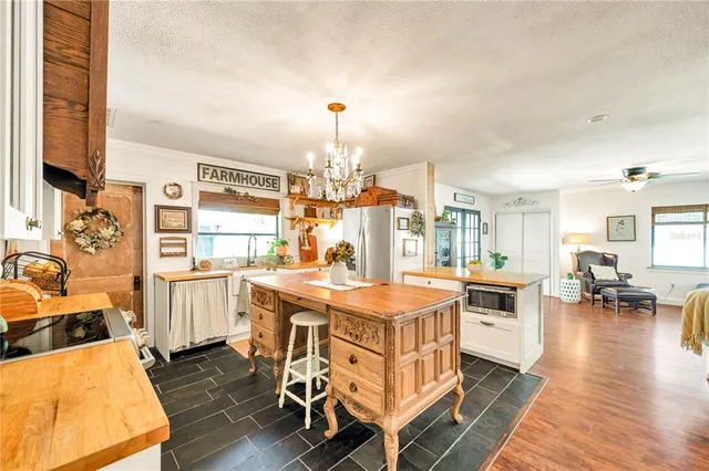 a kitchen that has a table and chairs in it