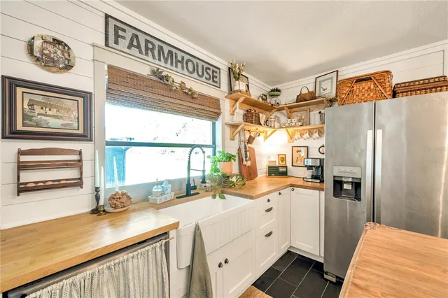 a kitchen with stainless steel appliances a refrigerator and a stove