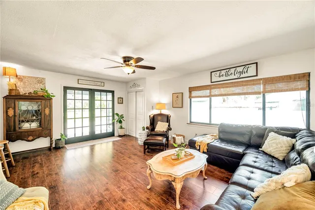 a living room with furniture and a large window