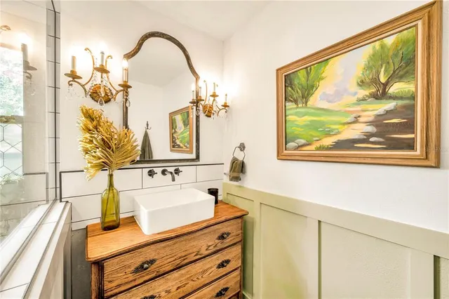 a view of a kitchen with wooden floor and a large window