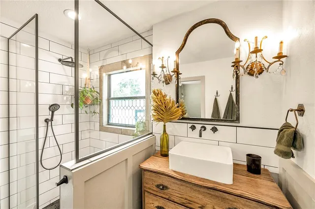 a bathroom with a sink and mirror