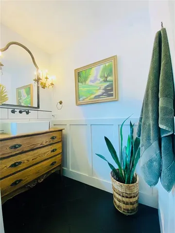 a view of room with window and potted plant