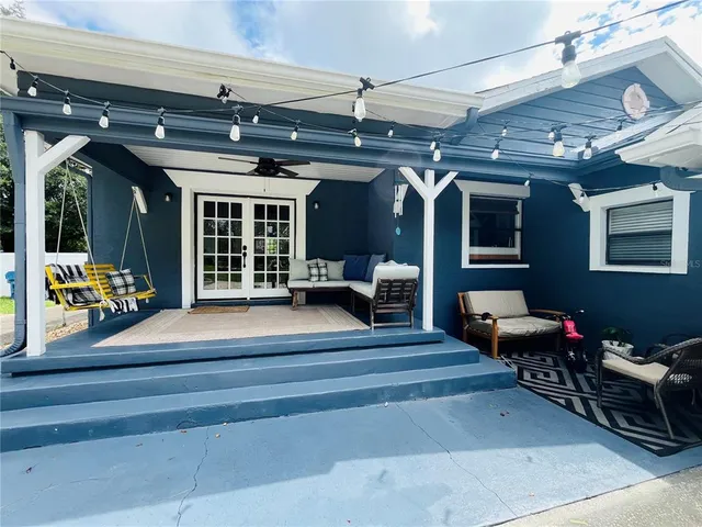 a living room with furniture and a large window