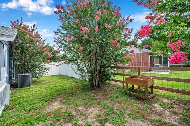 a view of a road with a house in the background