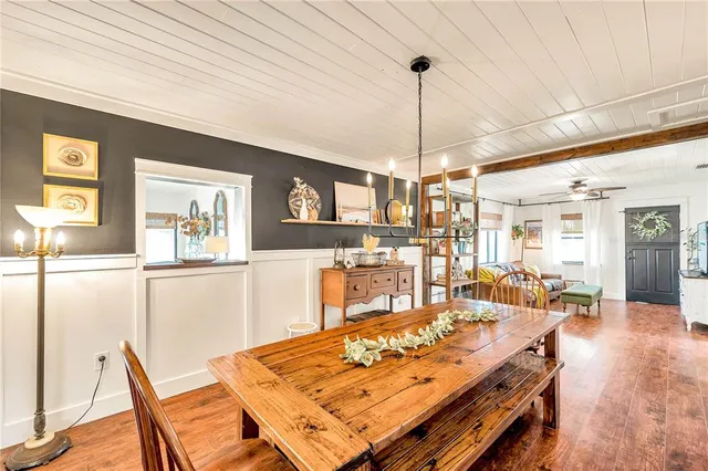 a view of a dining room with furniture window and wooden floor