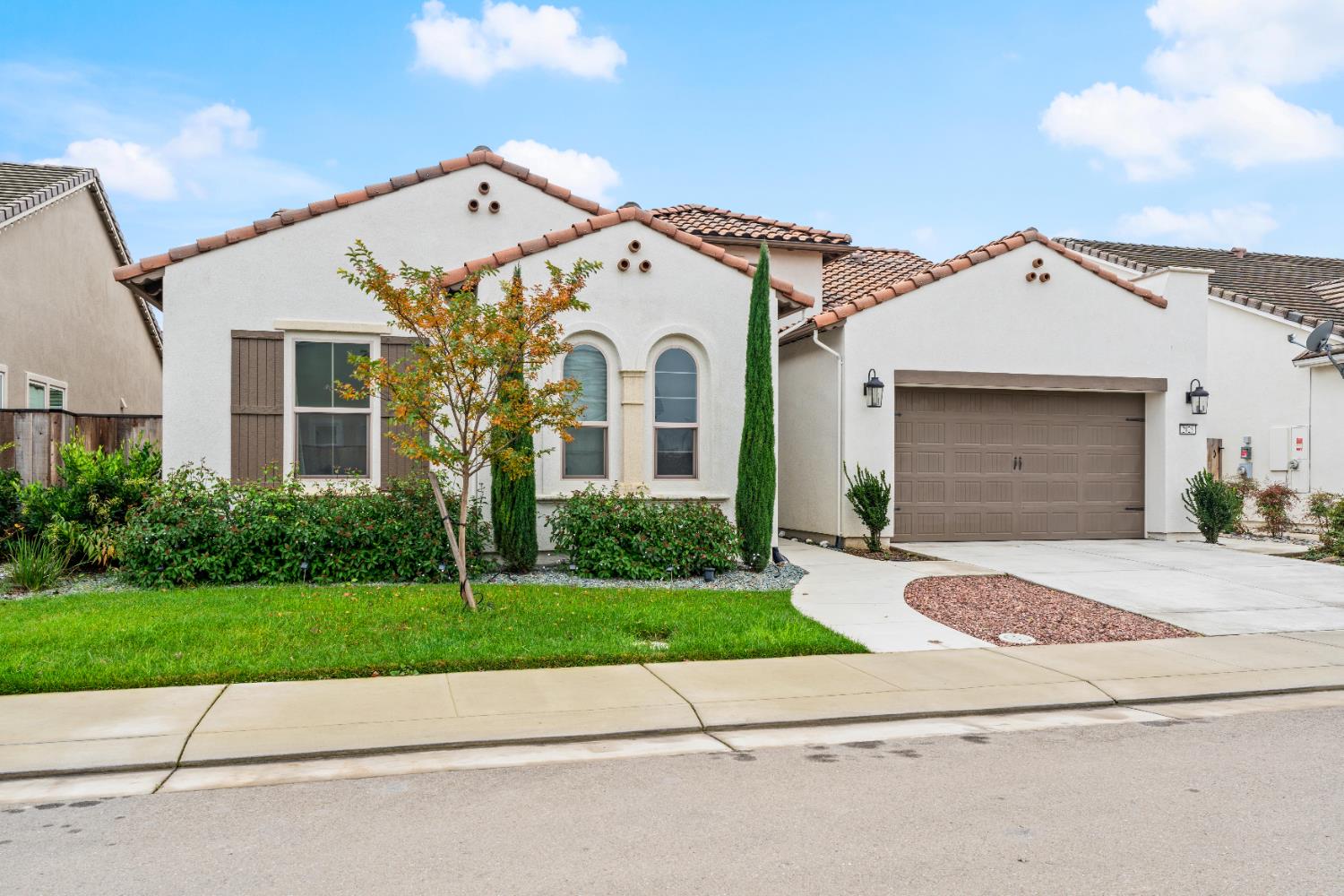 2826 Cameo Street Lodi, CA 95242 - Photo 12 of 52 a front view of a house with a yard and garage
