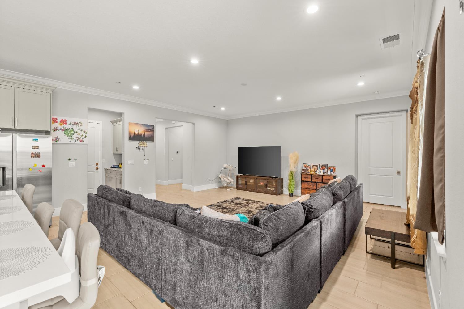 2826 Cameo Street Lodi, CA 95242 - Photo 33 of 52 a living room with furniture and a flat screen tv