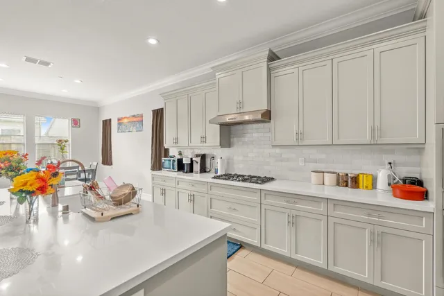 a view of a dining room with furniture and window