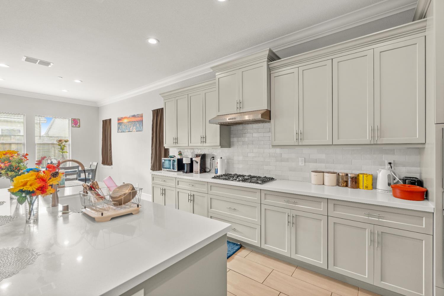 2826 Cameo Street Lodi, CA 95242 - Photo 36 of 52 a kitchen with stainless steel appliances white cabinets sink and wooden floor