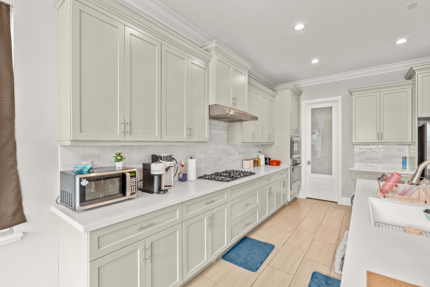 2826 Cameo Street Lodi, CA 95242 - Photo 40 of 52 a kitchen with a sink and cabinets