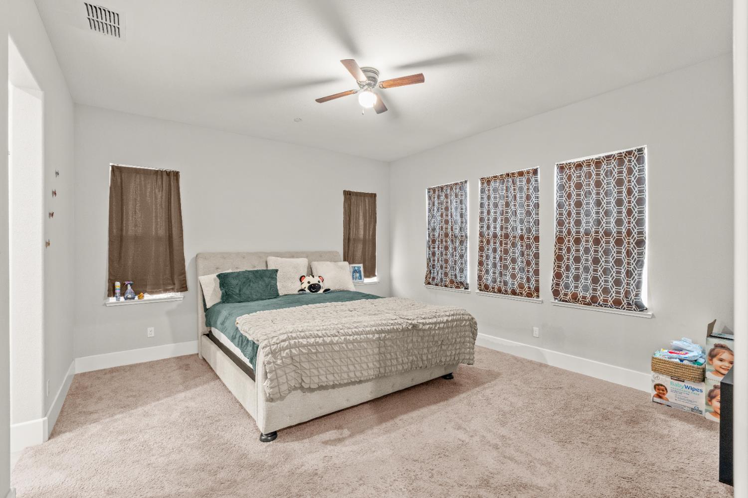 2826 Cameo Street Lodi, CA 95242 - Photo 42 of 52 a bedroom with a bed a couch and a window