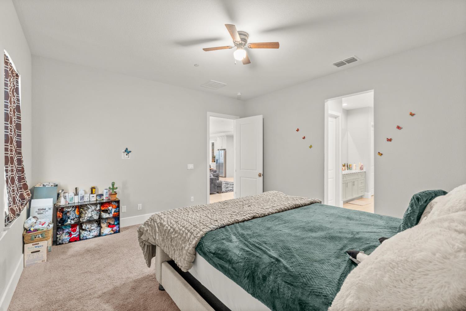 2826 Cameo Street Lodi, CA 95242 - Photo 44 of 52 a bedroom with a bed closet and a chandelier