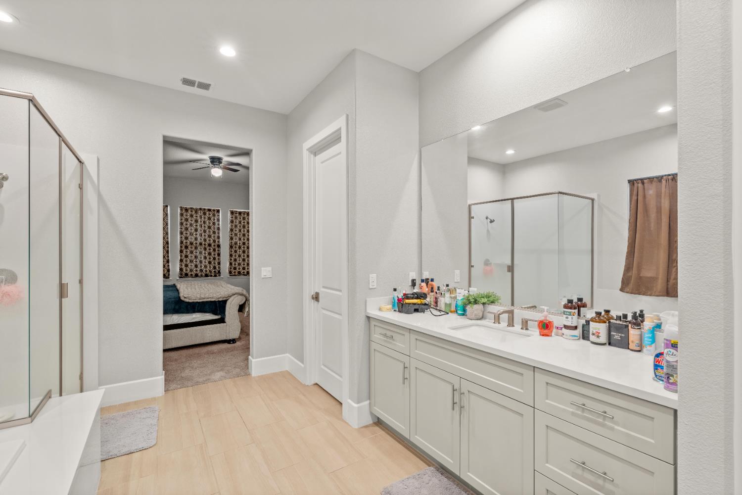 2826 Cameo Street Lodi, CA 95242 - Photo 48 of 52 a bathroom with double vanity sinks a mirror and a shower