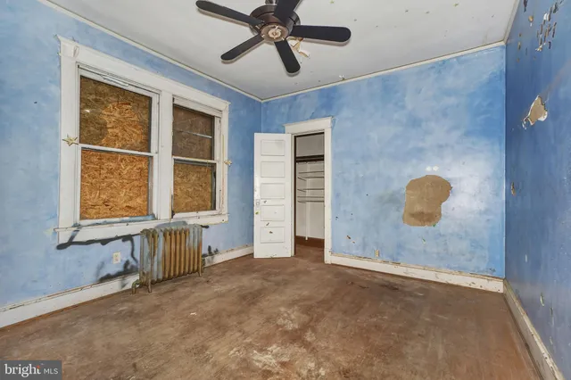 a bathroom with a sink toilet and a mirror