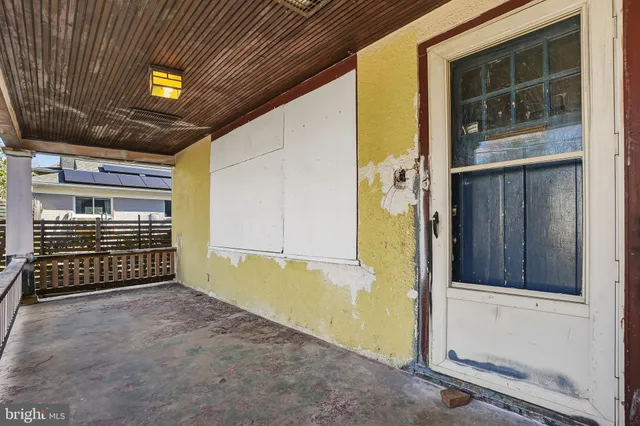 a view of an empty room with a fireplace