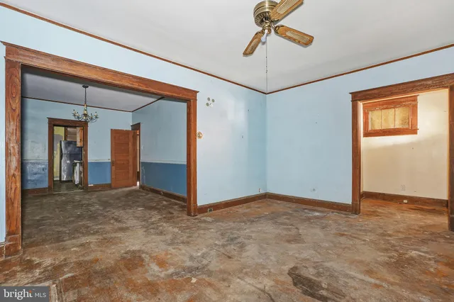 an empty room with fan