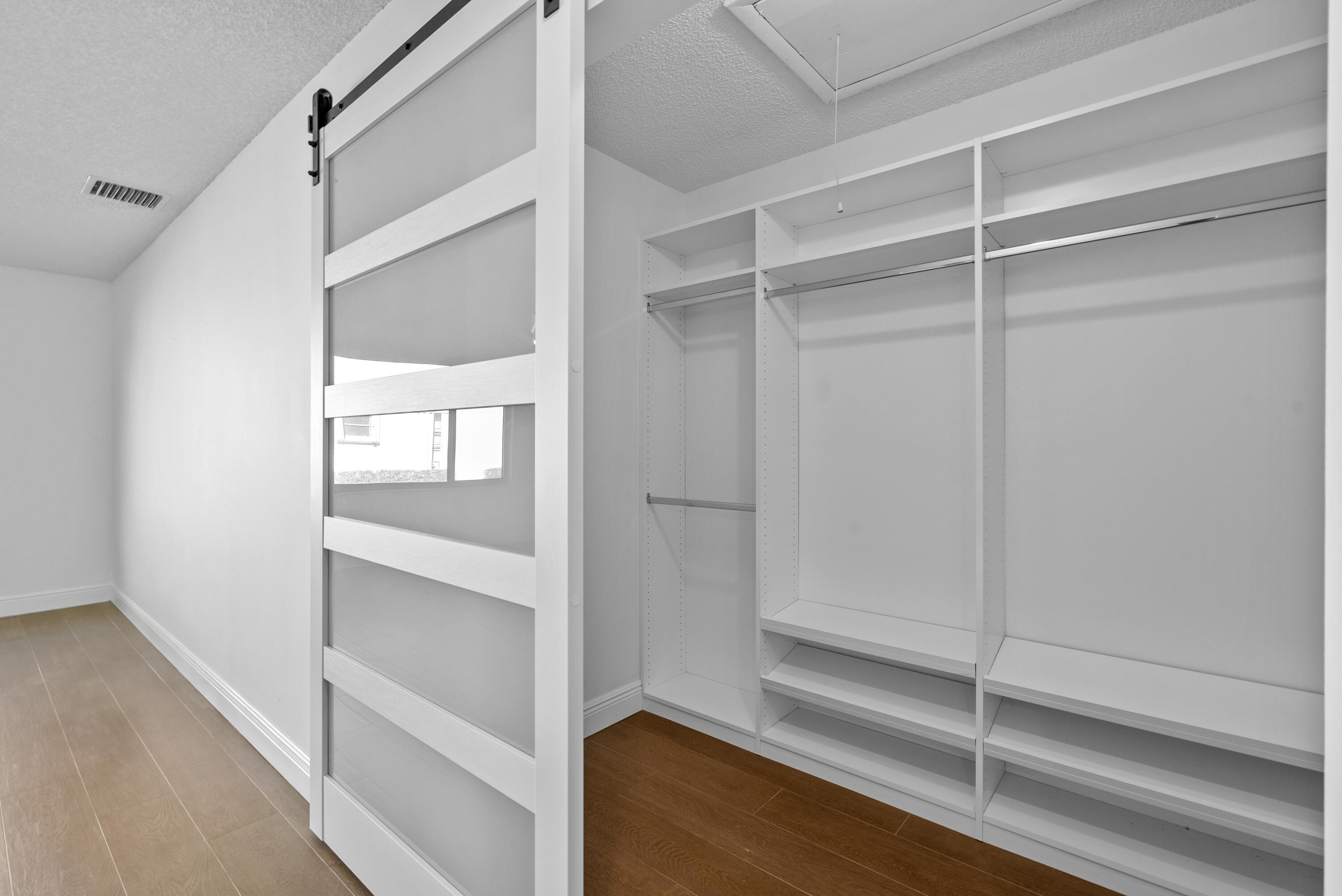 5110 Nesting Way, Unit B Delray Beach, FL 33484 - Photo 18 of 29 a view of an empty walk in closet