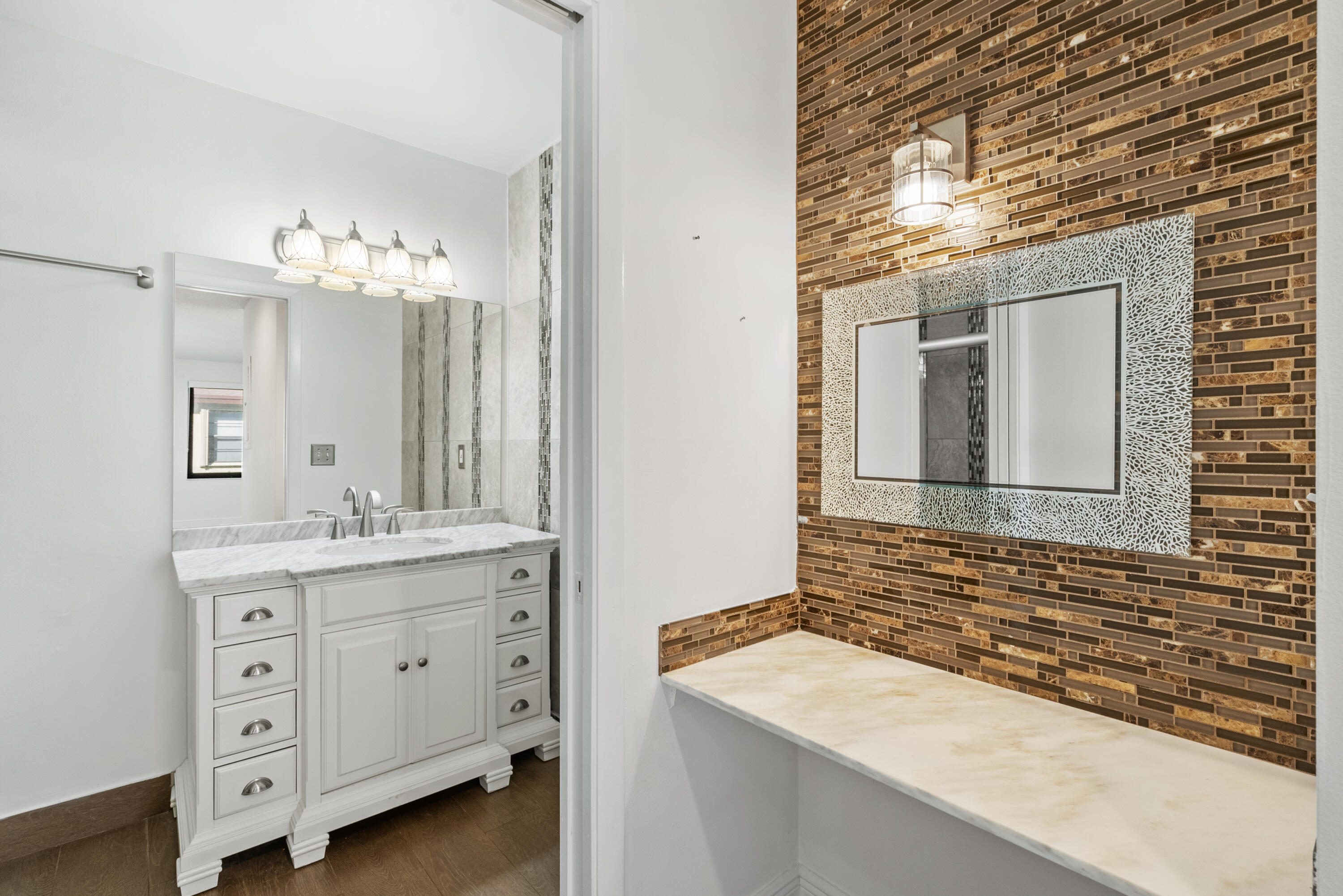 5110 Nesting Way, Unit B Delray Beach, FL 33484 - Photo 19 of 29 a bathroom with a granite countertop sink and a mirror