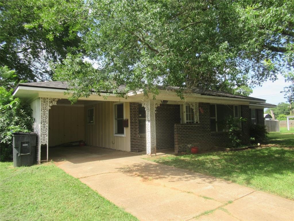 2513 Rosedale Place Bossier City, LA 71111 - Photo 2 of 13 Brick and siding exterior featuring a covered carport with decorative ironwork