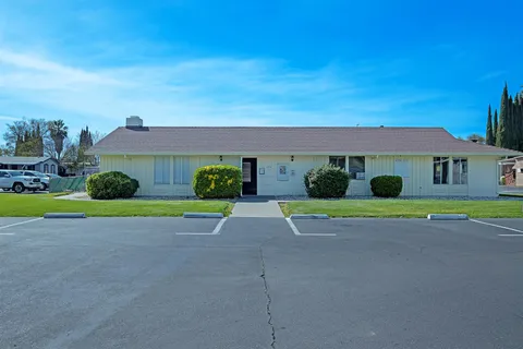 a house with yard in front of it