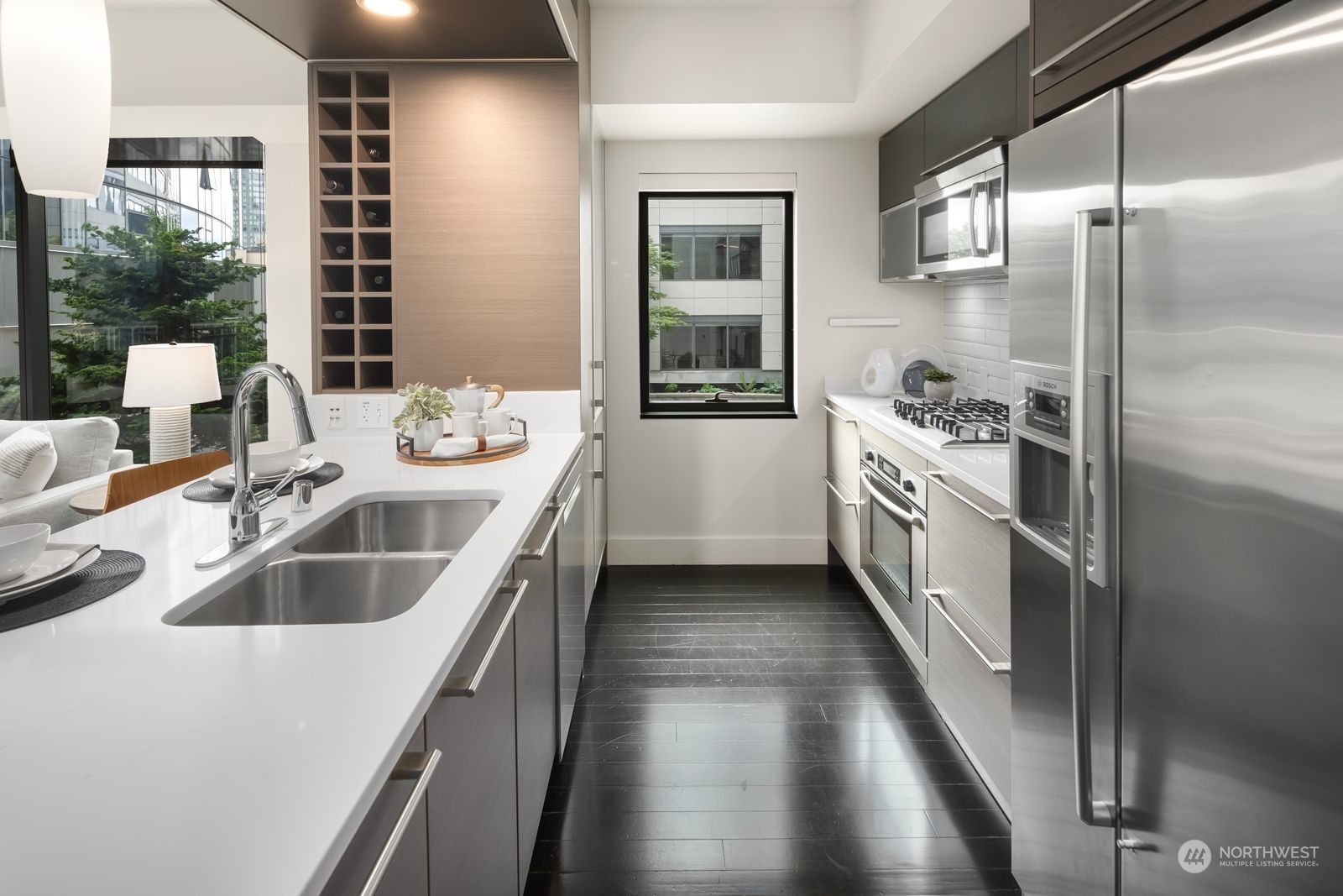820 Blanchard Street, Unit 708 Seattle, WA 98121 - Photo 11 of 33 a kitchen with a sink stove and refrigerator
