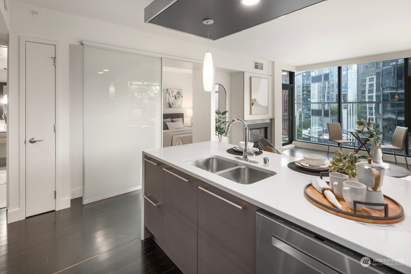 820 Blanchard Street, Unit 708 Seattle, WA 98121 - Photo 13 of 33 a kitchen with a sink and wooden floor