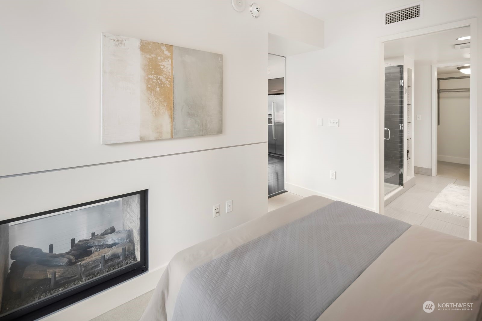 820 Blanchard Street, Unit 708 Seattle, WA 98121 - Photo 18 of 33 a bedroom with a bed and a painting on the wall