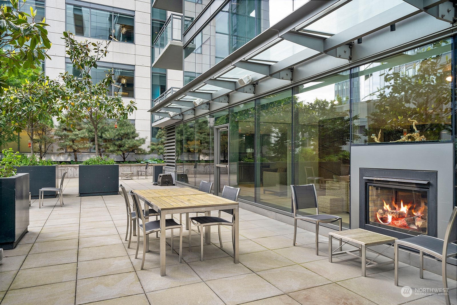 820 Blanchard Street, Unit 708 Seattle, WA 98121 - Photo 25 of 33 a view of a patio with a table and chairs