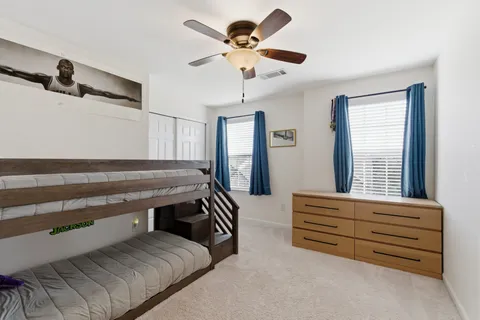 a bedroom with furniture and window
