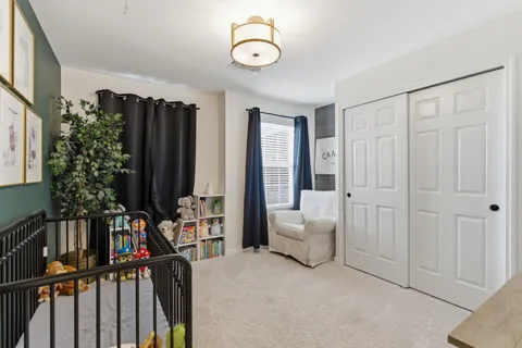a view of a livingroom with furniture and staircase